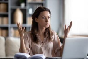 frustrated woman using laptop